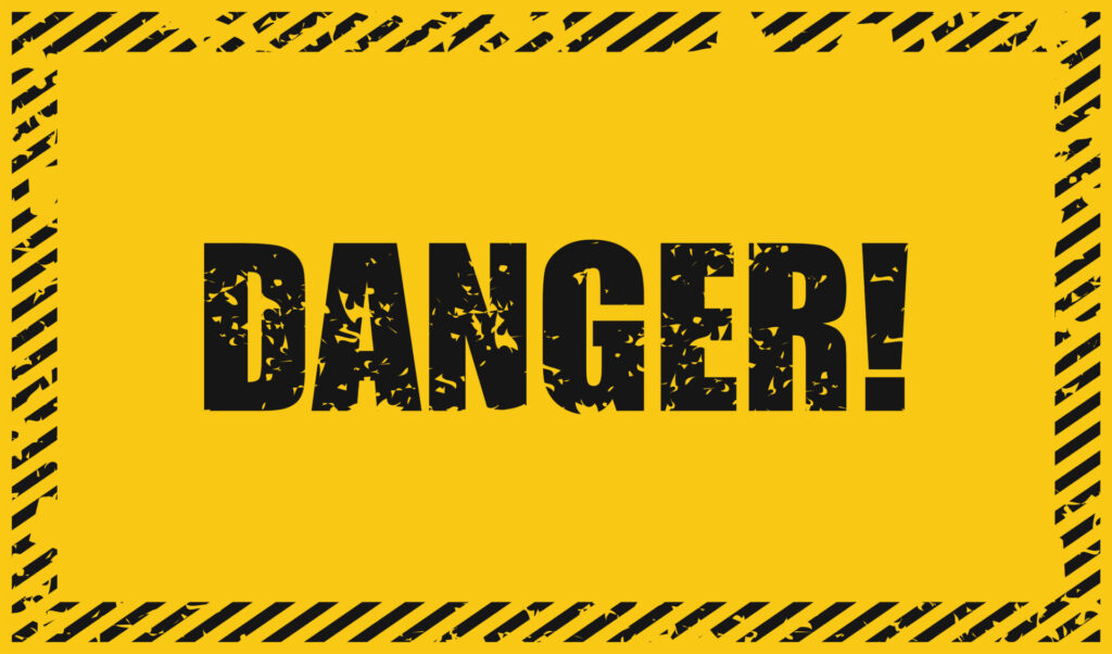 黄色と黒の背景に「DANGER!」と大きく書かれた、危険を知らせる警告サイン。