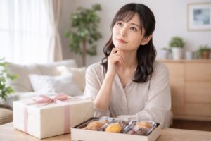 担当医師へのお礼としてお菓子が必要か考えている日本人女性
